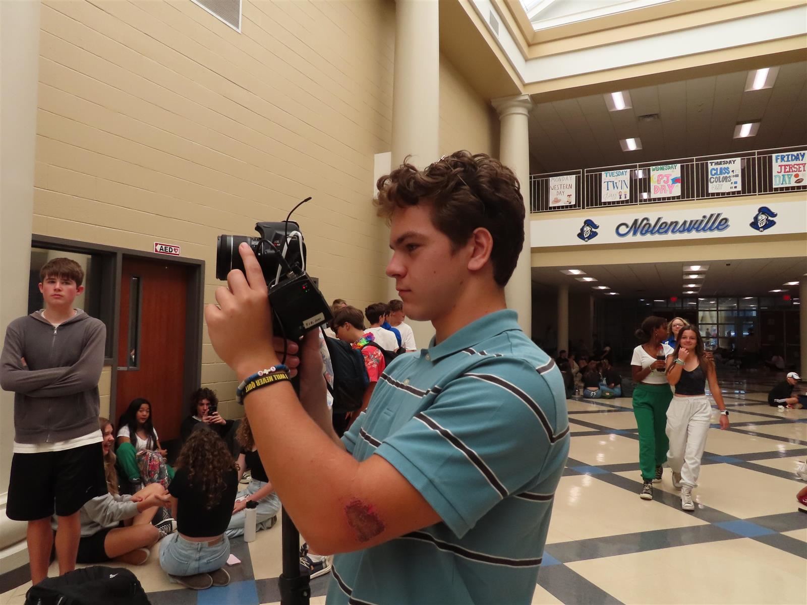 Student with Camera